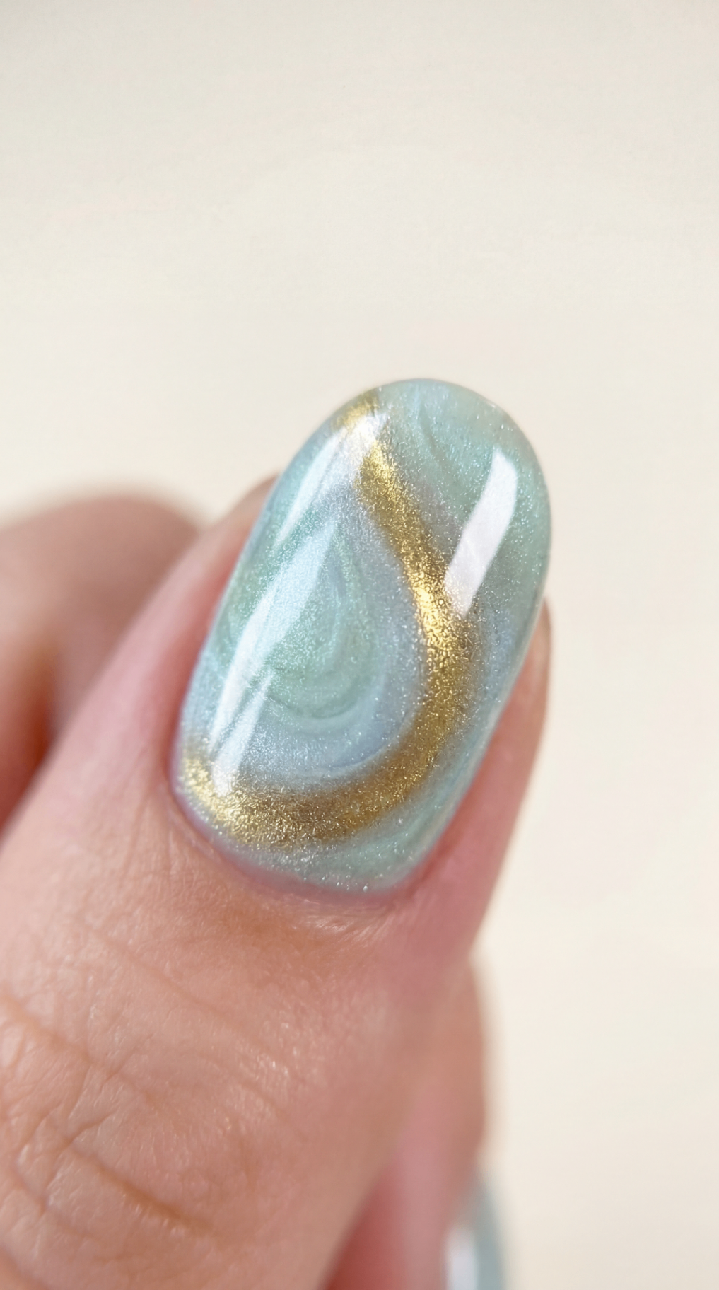 Magnetic cat-eye manicure detail catching the light
